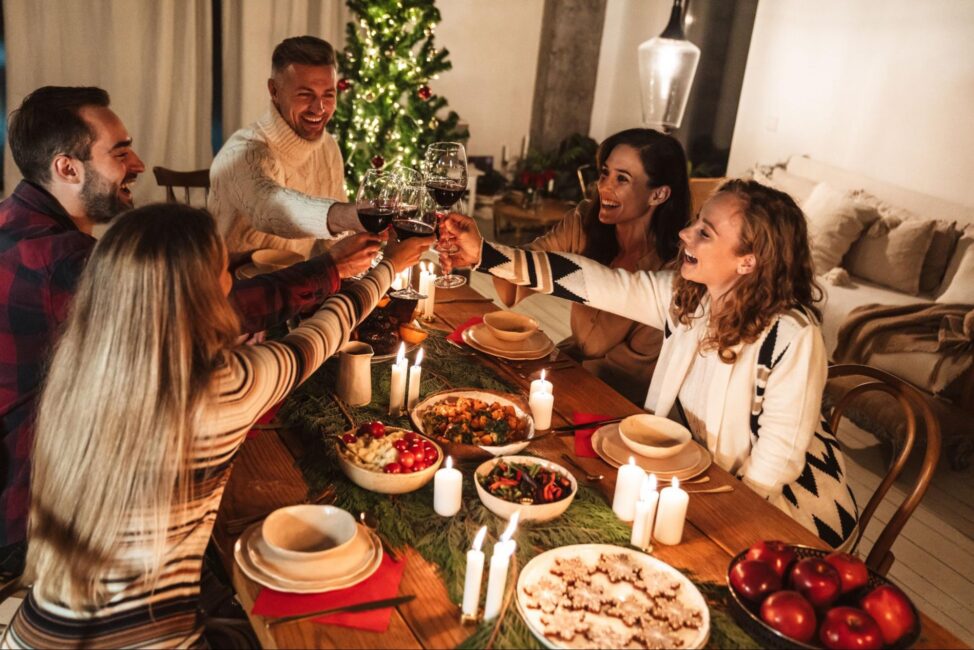 Group of friends enjoying an affordable holiday dinner 
