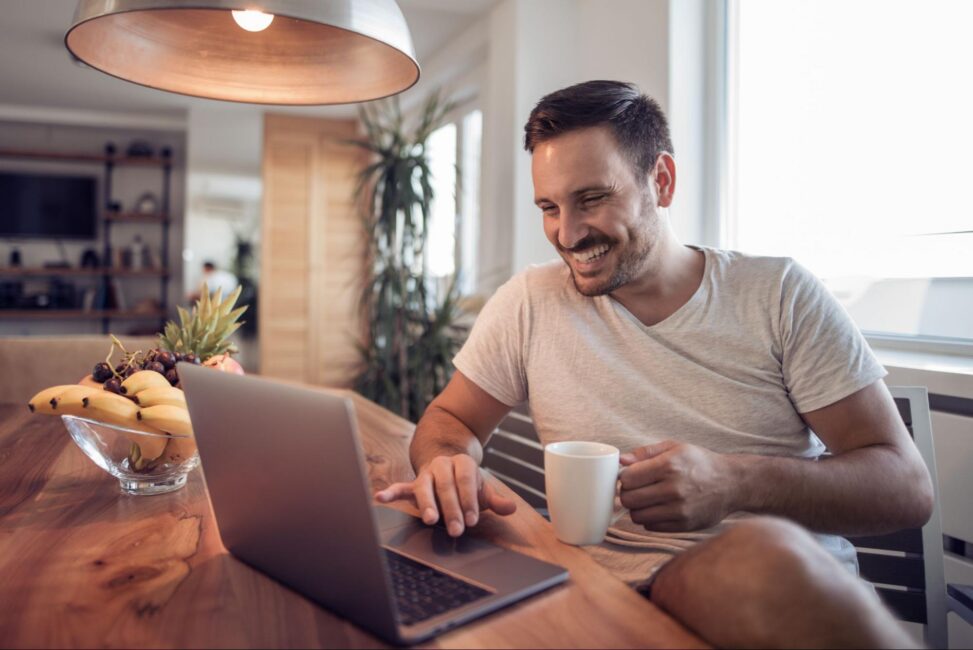 Cheerful man is happy because he set up auto-pay to handle bills