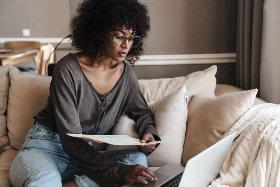 Woman thinking about opening a checking and savings accountÂ