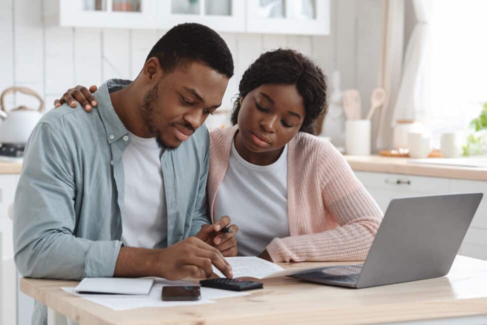 Serious couple reviewing loan options