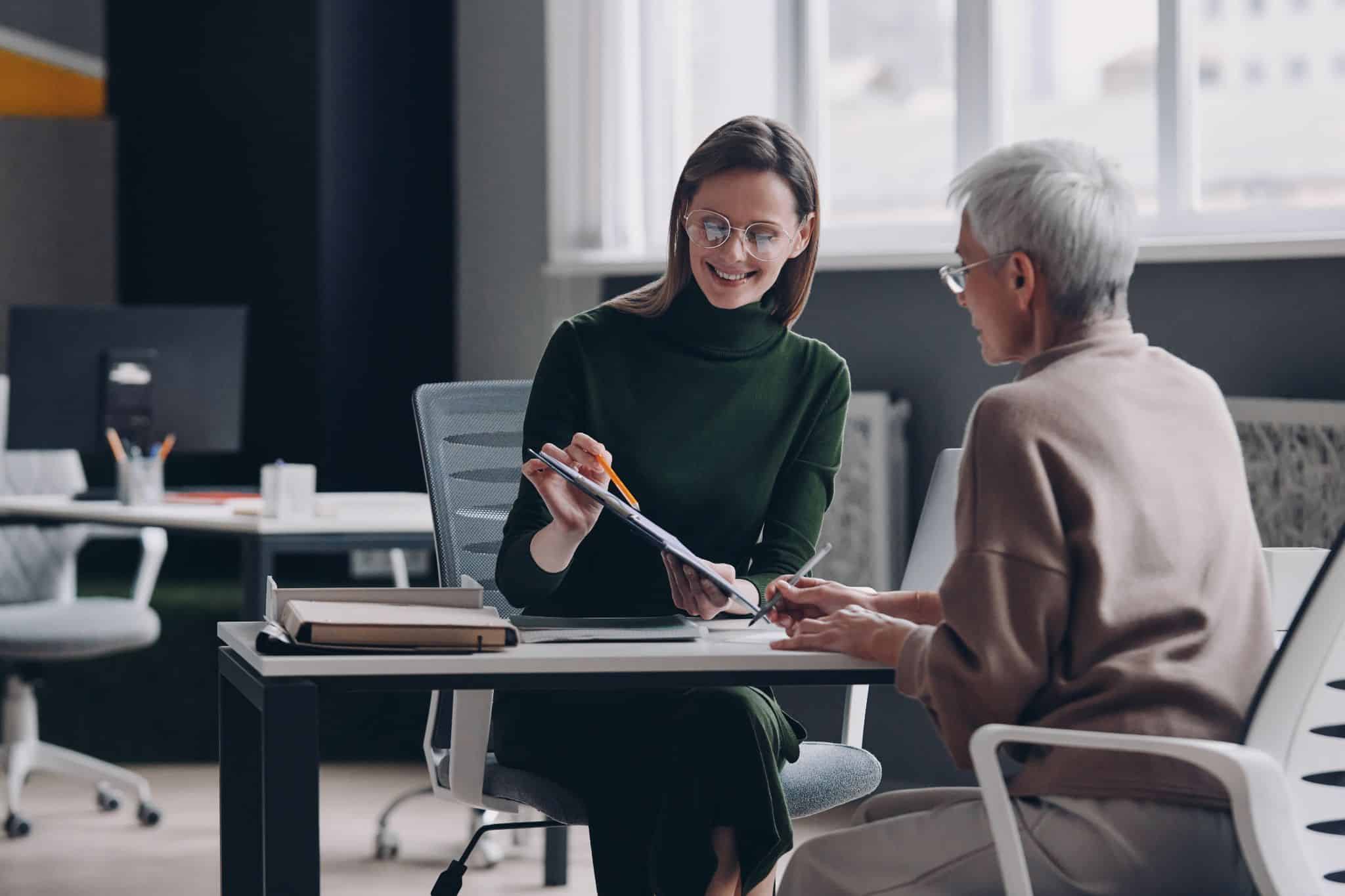 Financial advisor discussing balance transfer alternatives with a senior woman